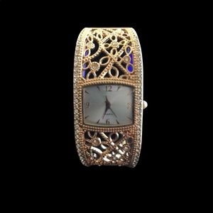 Gold intricate design bangle watch